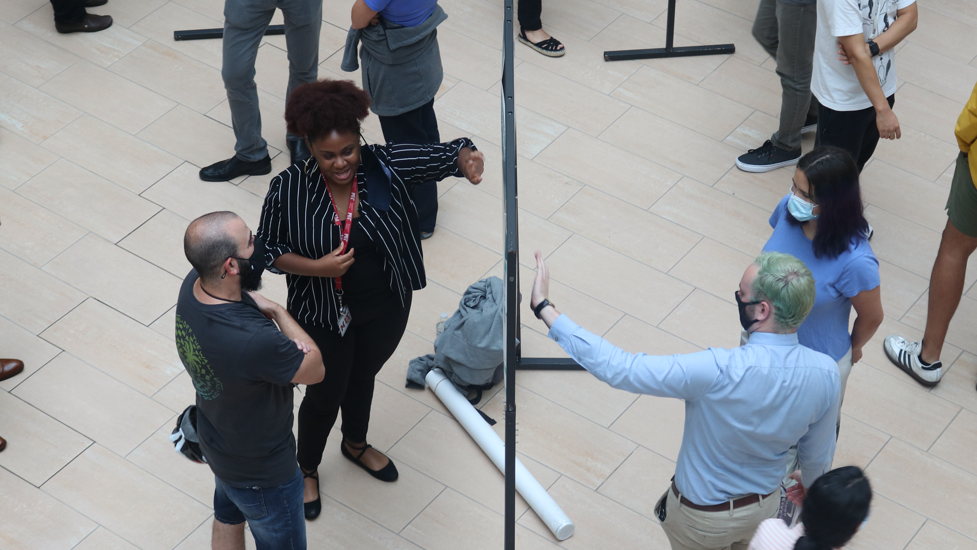 students discuss their research during a poster session